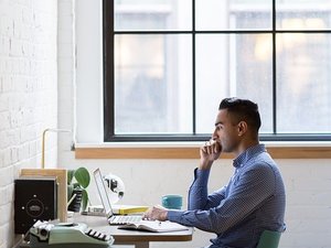 man at computer desk