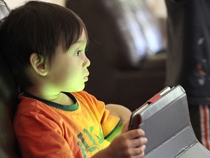 kid on tablet