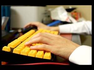 typing on yellow keyboard