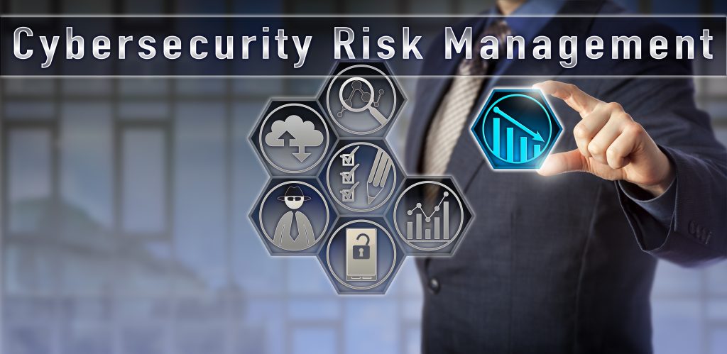 A person in a business suit presses a screen with lowered cybersecurity risk.