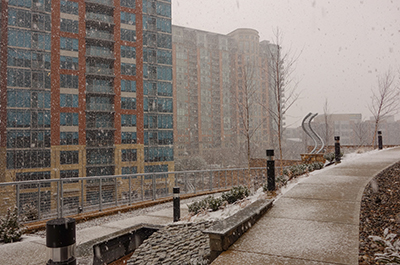 Snow falling on Mclean, VA, with business buildings in the background