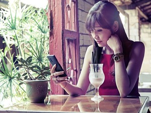 woman checking phone messages